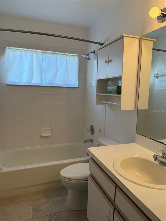 4501 River Ridge Drive Leesburg, FL 34748 - Photo 9 of 16 a bathroom with a sink a toilet and shower