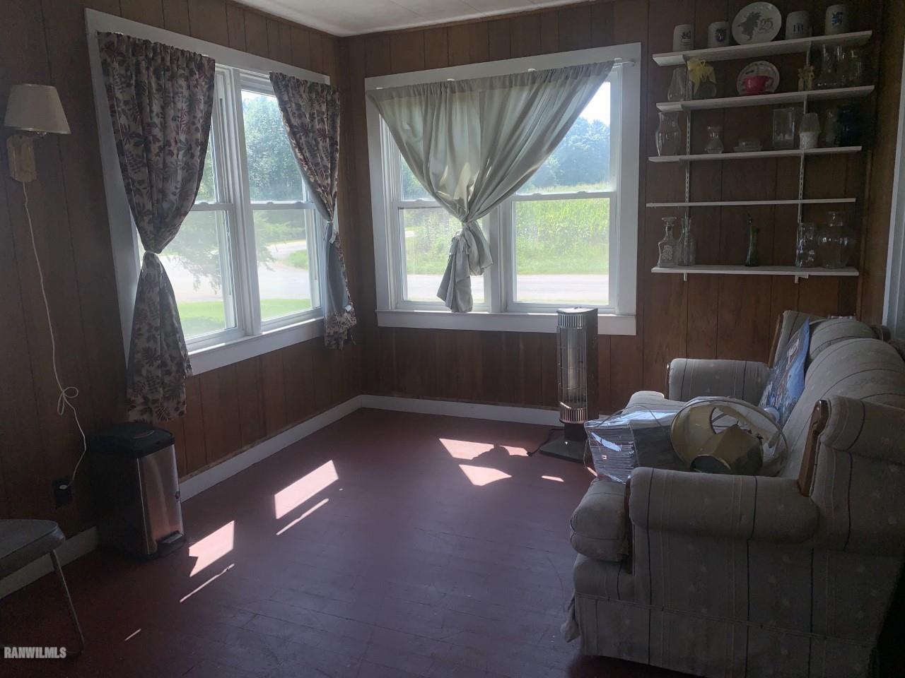 21287 Argo Fay Route Chadwick, IL 61014 - Photo 5 of 9 a living room with furniture and a large window