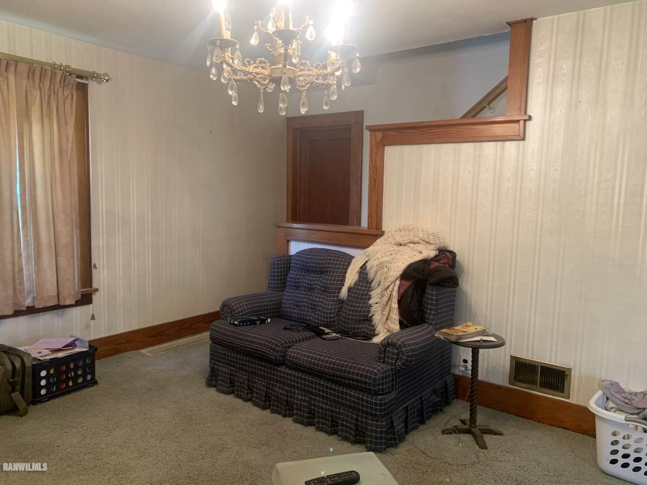 21287 Argo Fay Route Chadwick, IL 61014 - Photo 6 of 9 a living room with furniture and a chandelier