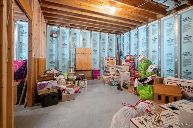 a bedroom with bed and a window