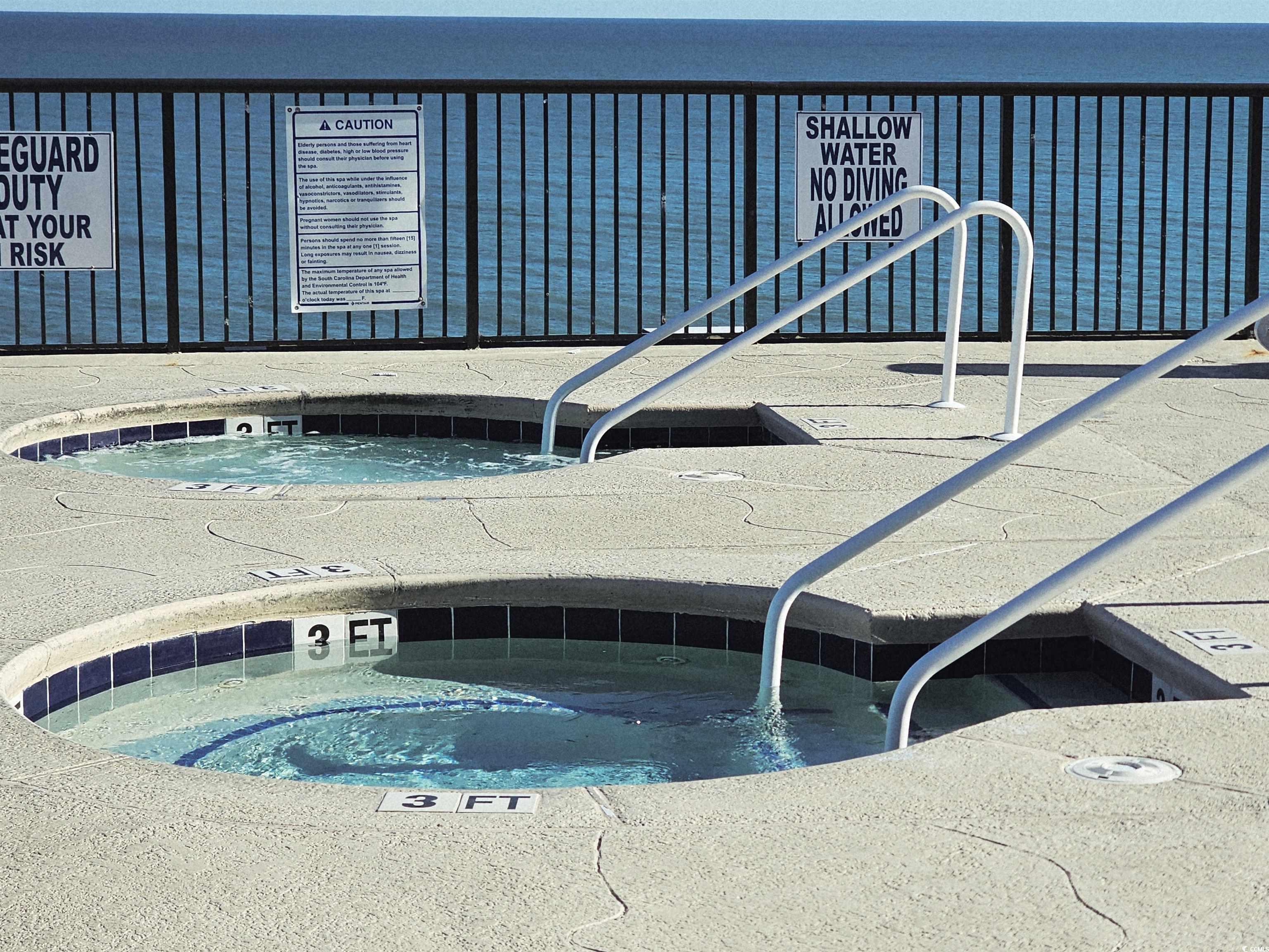 201 77th Avenue North, Unit 1025 Myrtle Beach, SC 29572 - Photo 15 of 36 View of swimming pool with a hot tub and a pool