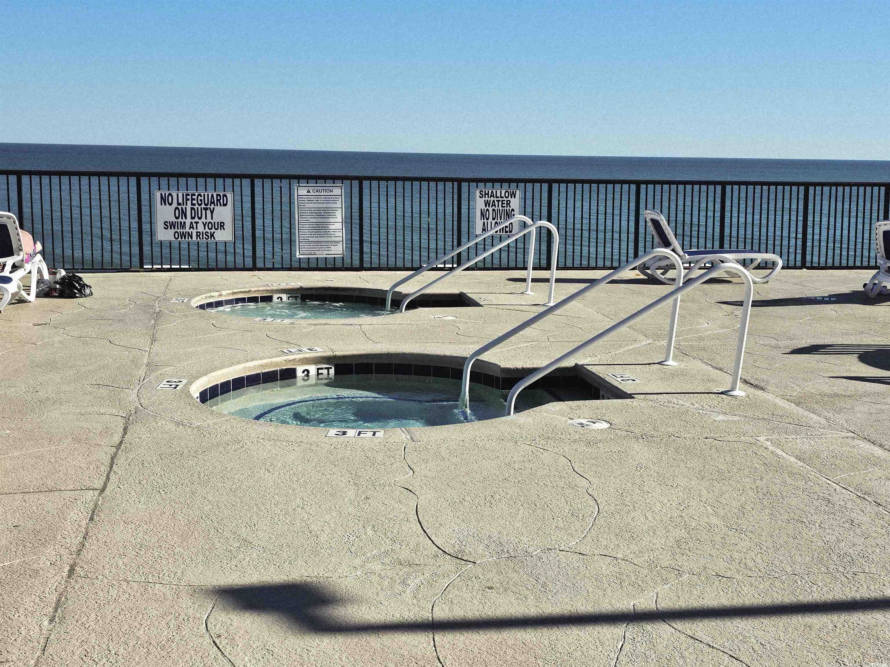 201 77th Avenue North, Unit 1025 Myrtle Beach, SC 29572 - Photo 16 of 36 View of swimming pool featuring a community hot tub