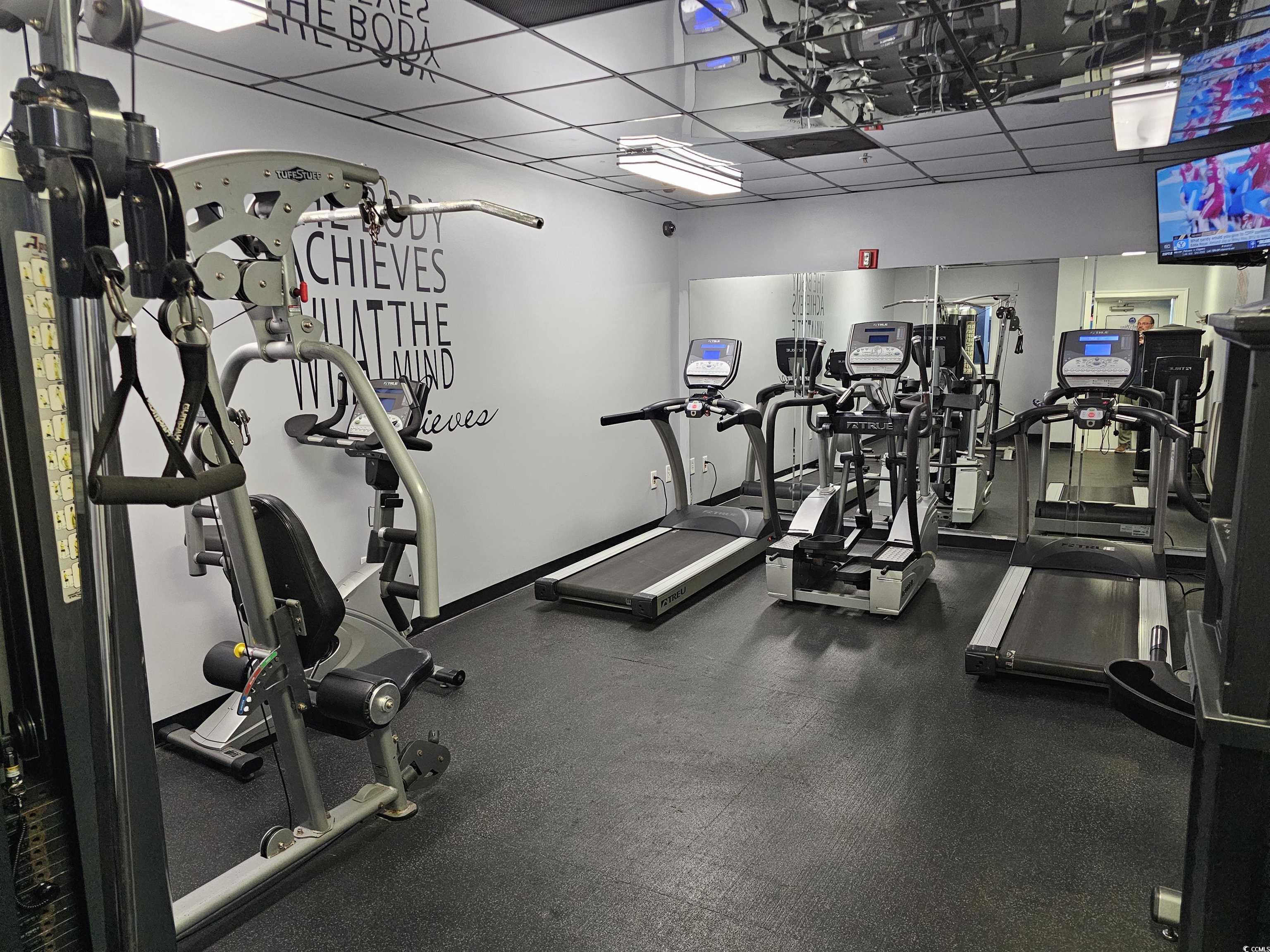 201 77th Avenue North, Unit 1025 Myrtle Beach, SC 29572 - Photo 20 of 36 Workout area featuring a drop ceiling