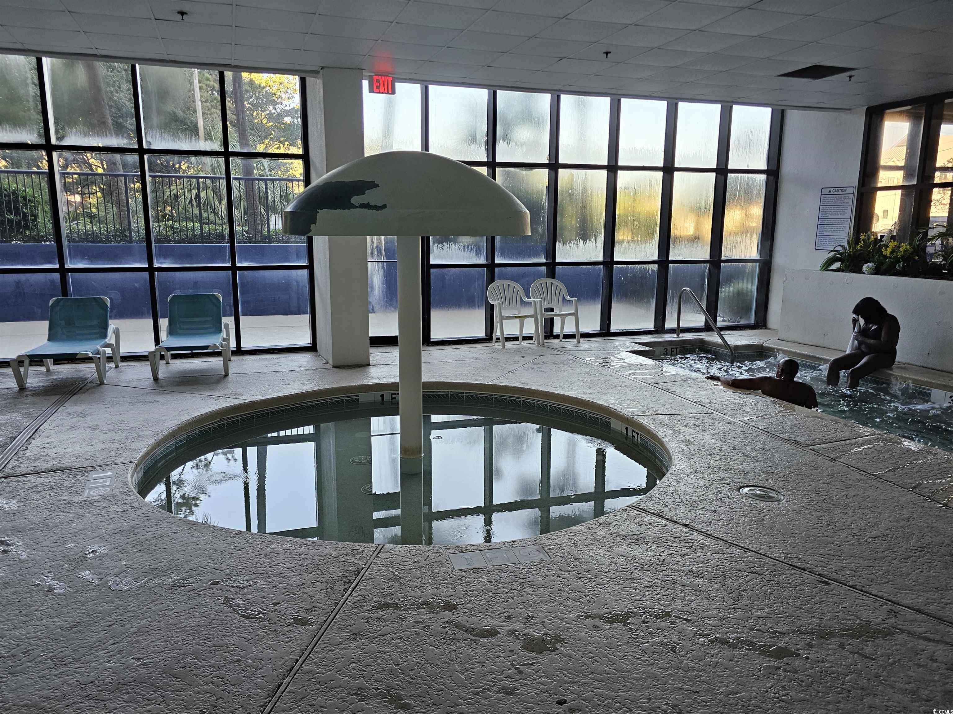 201 77th Avenue North, Unit 1025 Myrtle Beach, SC 29572 - Photo 36 of 36 View of swimming pool with an in-ground hot tub, a sunroom, and a swimming pool