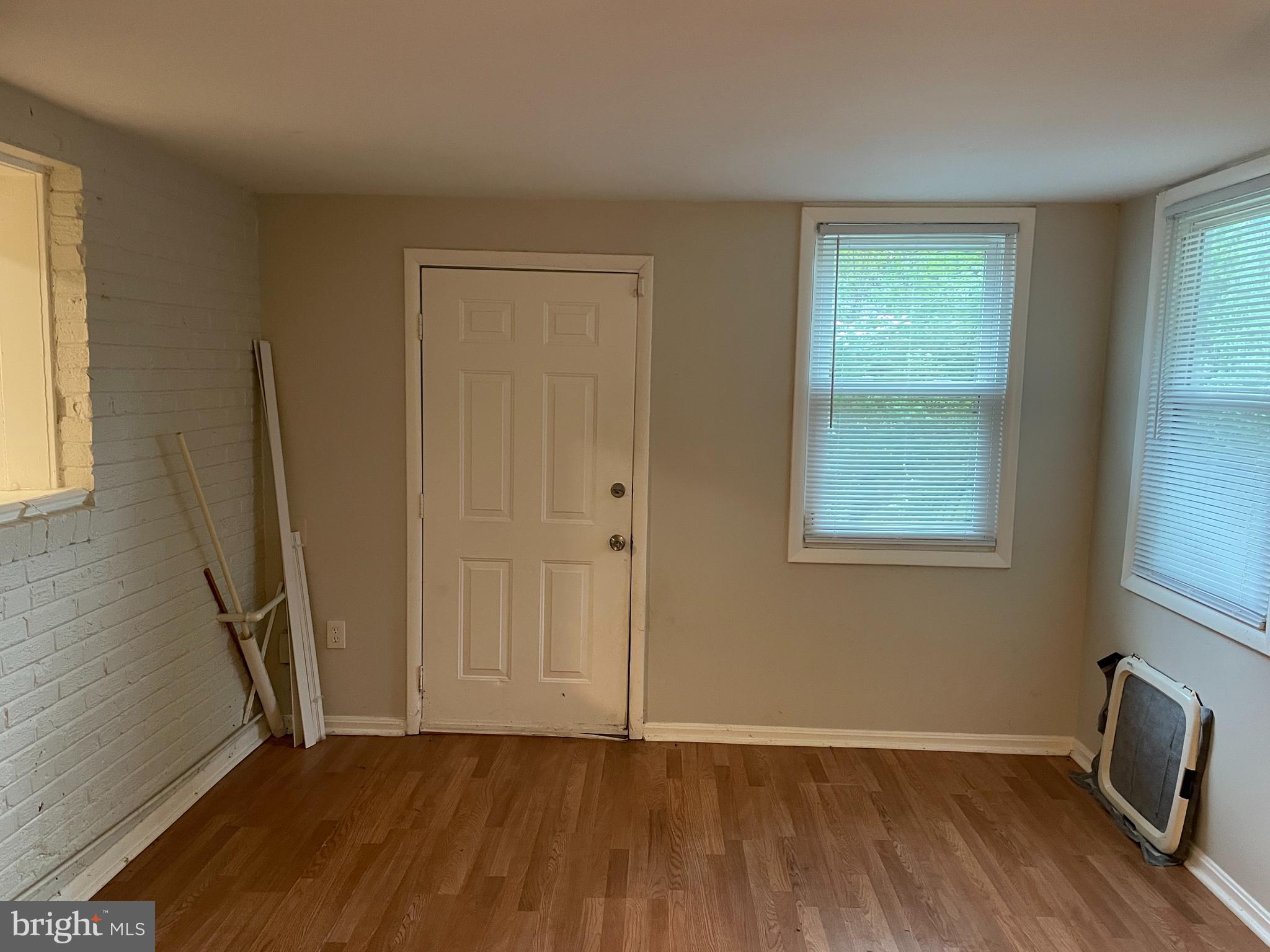 2307 Wyngate Road Suitland, MD 20746 - Photo 9 of 22 wooden floor in an empty room with a window