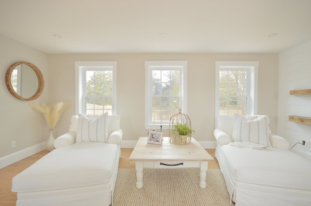 52 Uncle Barneys Road Dennis, MA 02670 - Photo 13 of 42 a living room with furniture and a large window