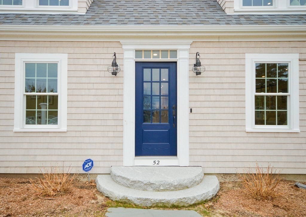 52 Uncle Barneys Road Dennis, MA 02670 - Photo 2 of 42 a view of a brick house with front door