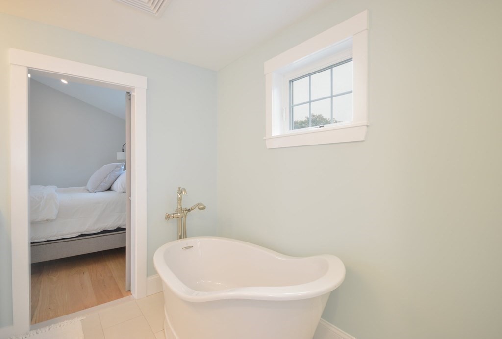 52 Uncle Barneys Road Dennis, MA 02670 - Photo 25 of 42 a bathroom with a white tub