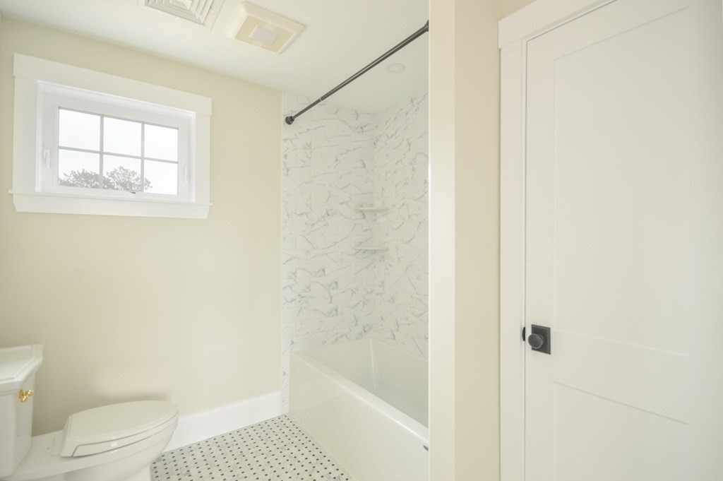 52 Uncle Barneys Road Dennis, MA 02670 - Photo 28 of 42 a bathroom with a bathtub and a toilet