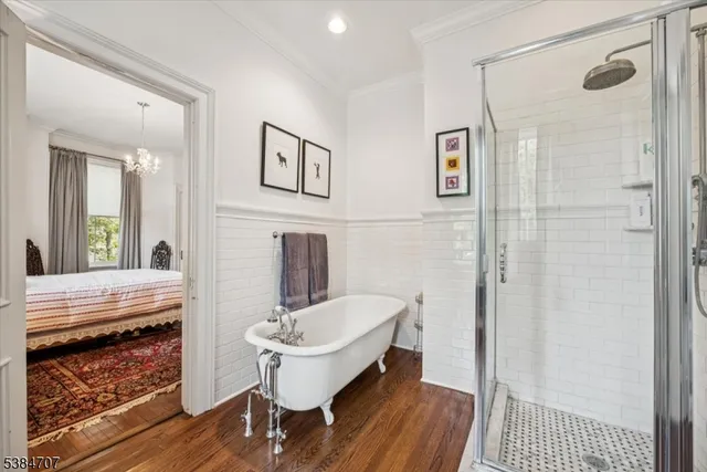 a bathroom with a sink a mirror and a shower
