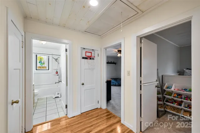 a view of a bedroom with bed and closet