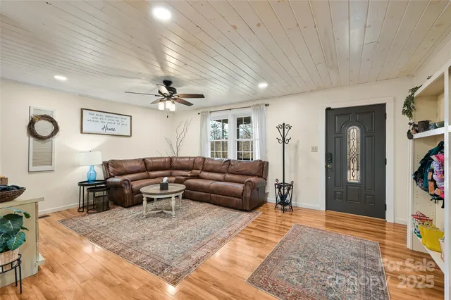 a living room with furniture and a rug