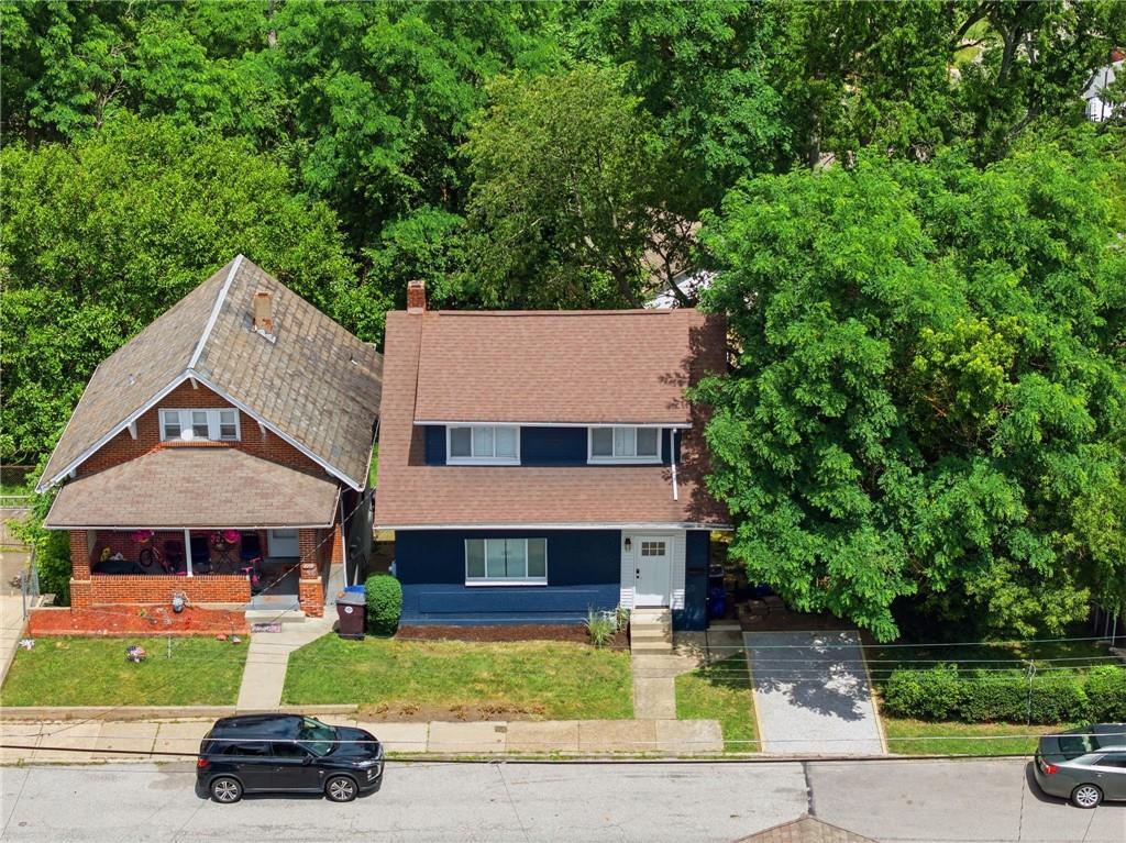 2961 Ruthwood Avenue Pittsburgh, PA 15227 - Photo 28 of 29 a front view of a house with a garden