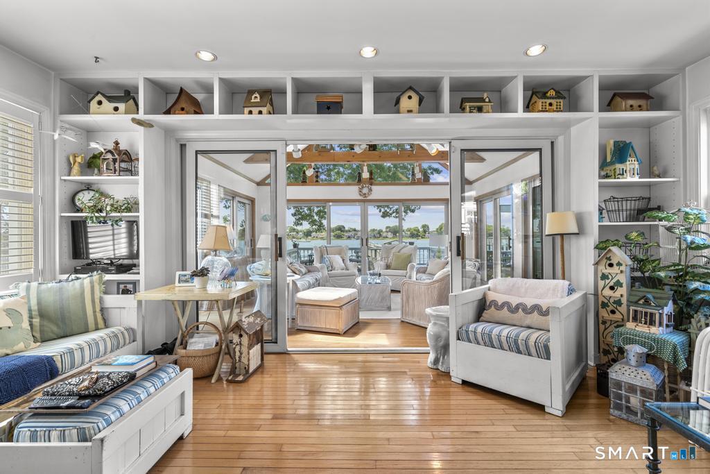 101 Edgemont Road Milford, CT 06460 - Photo 10 of 24 Living room that opens into the sun room with water views
