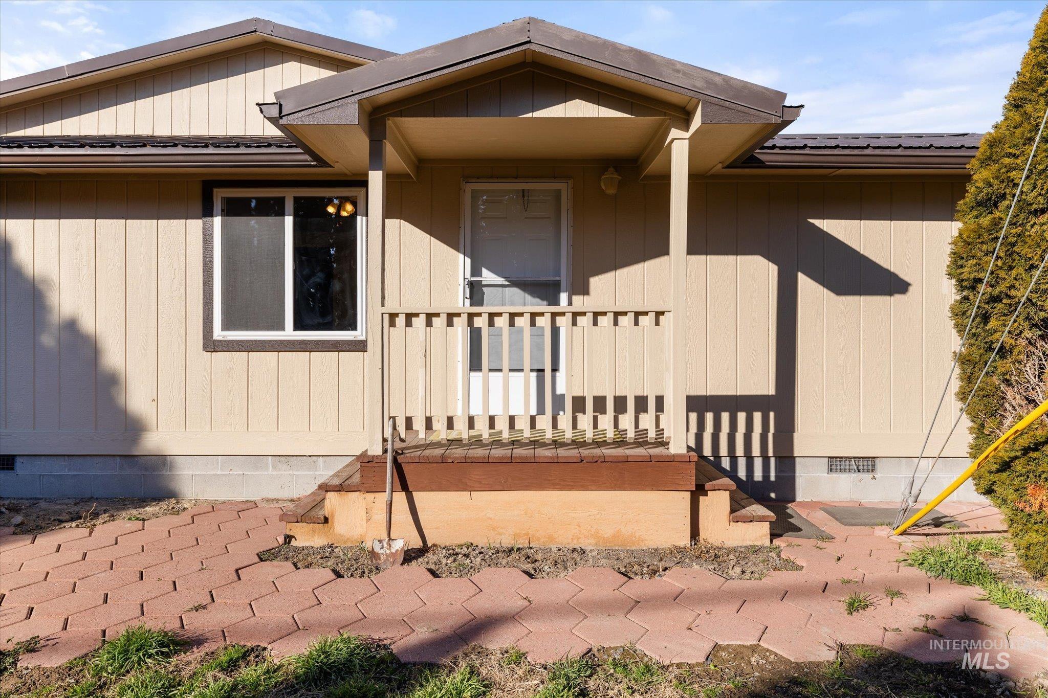 9820 Highway 44 Middleton, ID 83644 - Photo 12 of 50 Doorway to property with crawl space and a metal roof