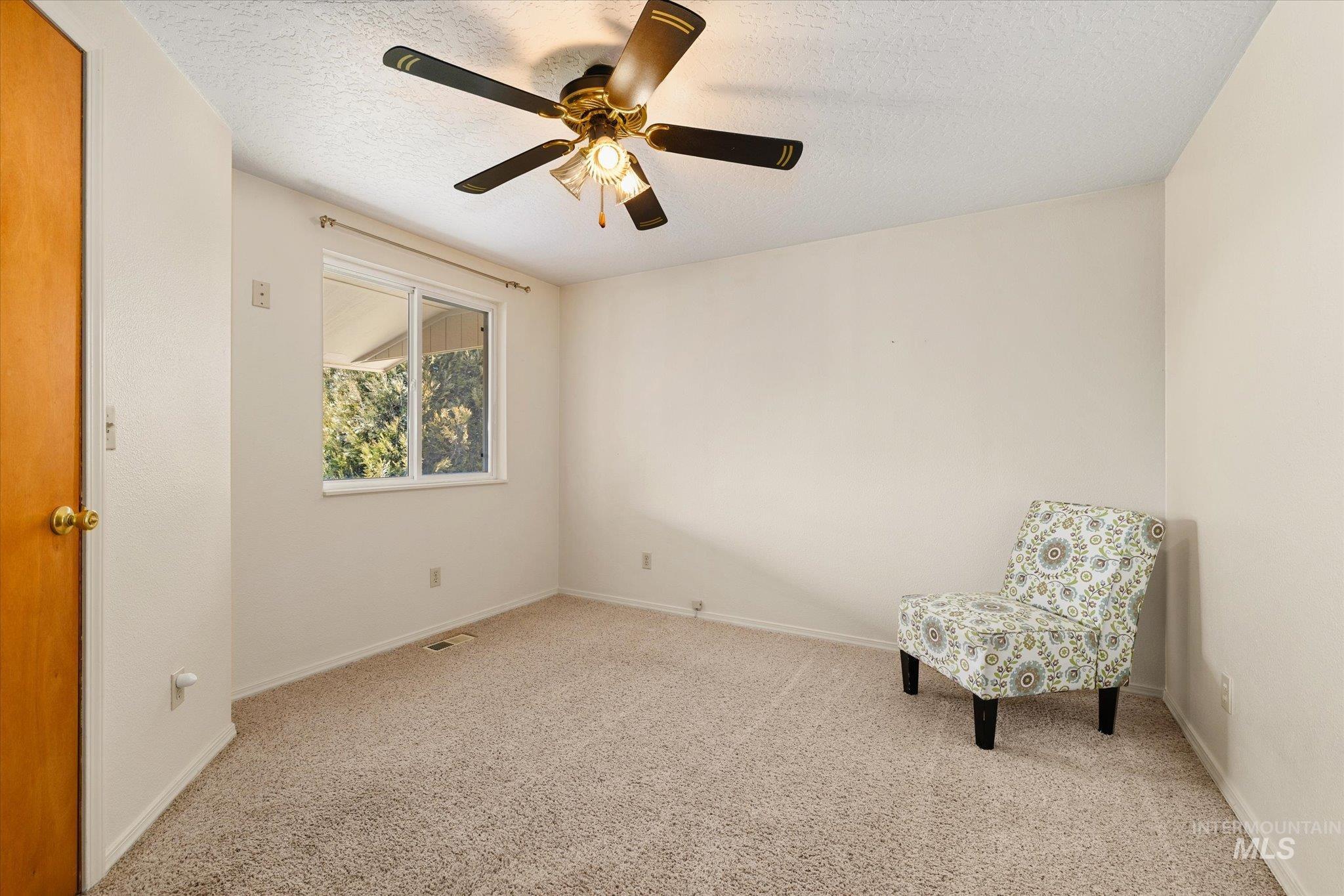 9820 Highway 44 Middleton, ID 83644 - Photo 29 of 50 Unfurnished room with a textured ceiling, a ceiling fan, and carpet floors