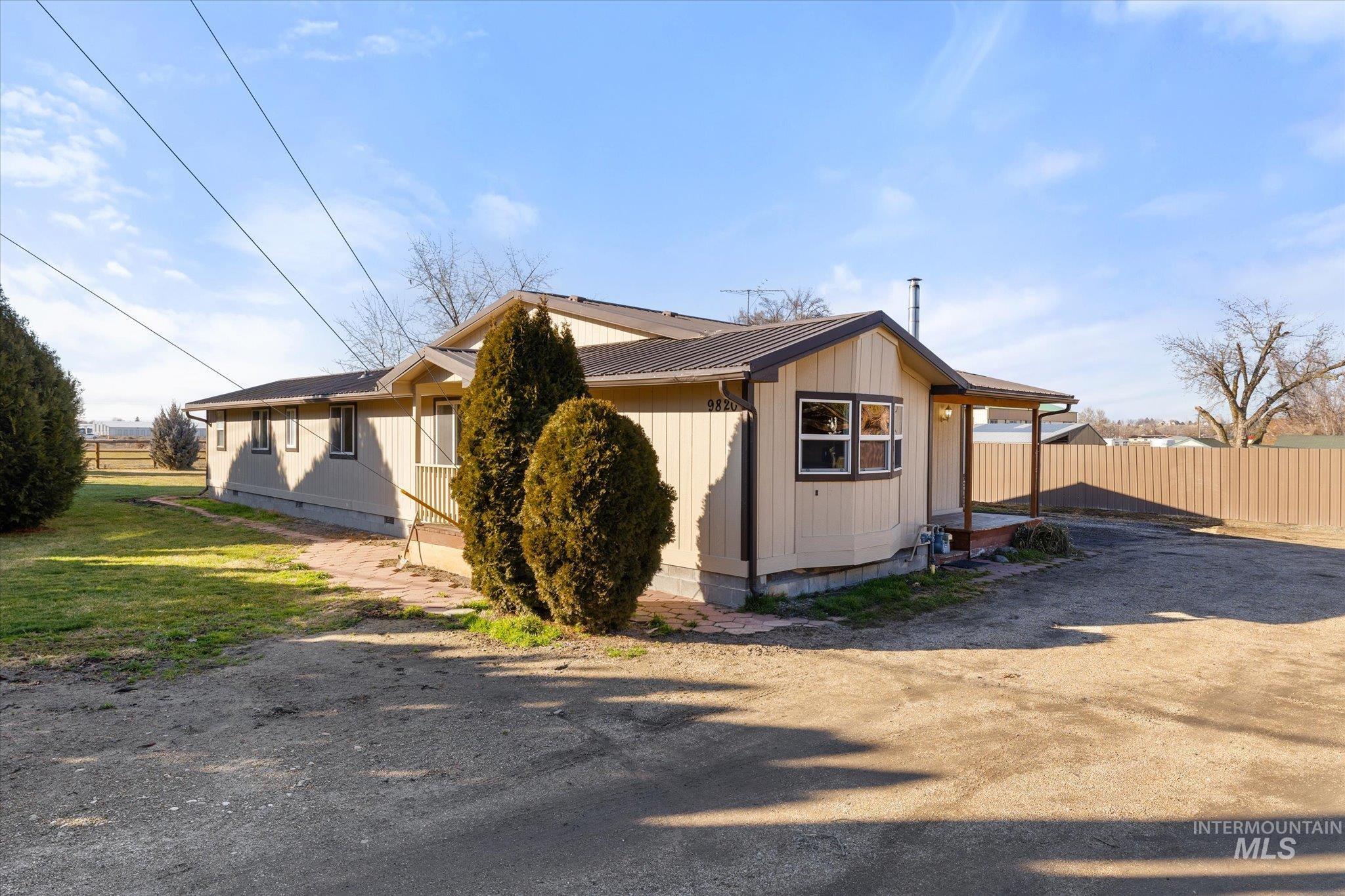 9820 Highway 44 Middleton, ID 83644 - Photo 49 of 50 View of side of home featuring crawl space and a metal roof