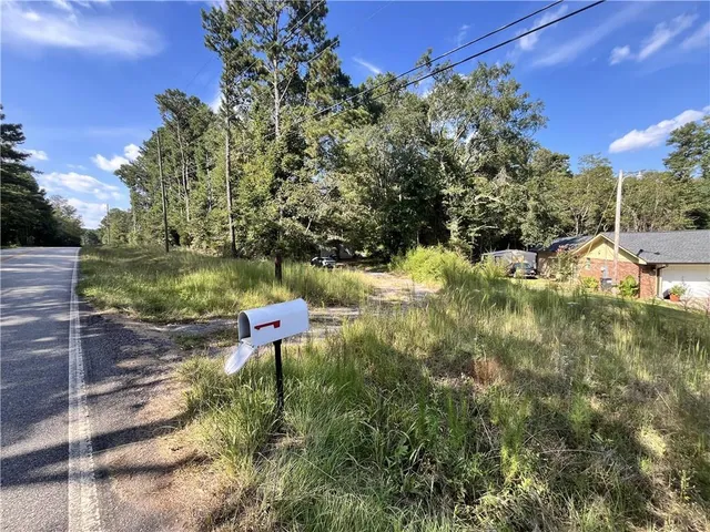 a view of a yard with an outdoor space