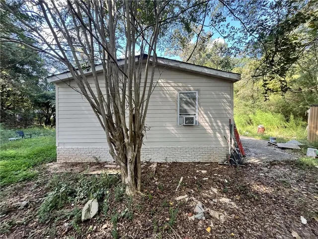 a view of a backyard with sitting area