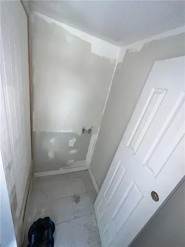 a view of entryway with a front door