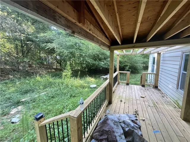 a view of balcony with wooden floor and outdoor space
