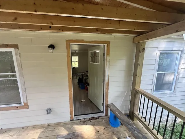 a view of a door and a window