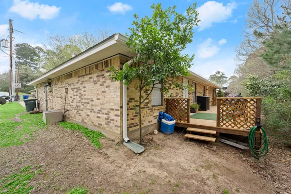 a wooden bench sitting in front of a house