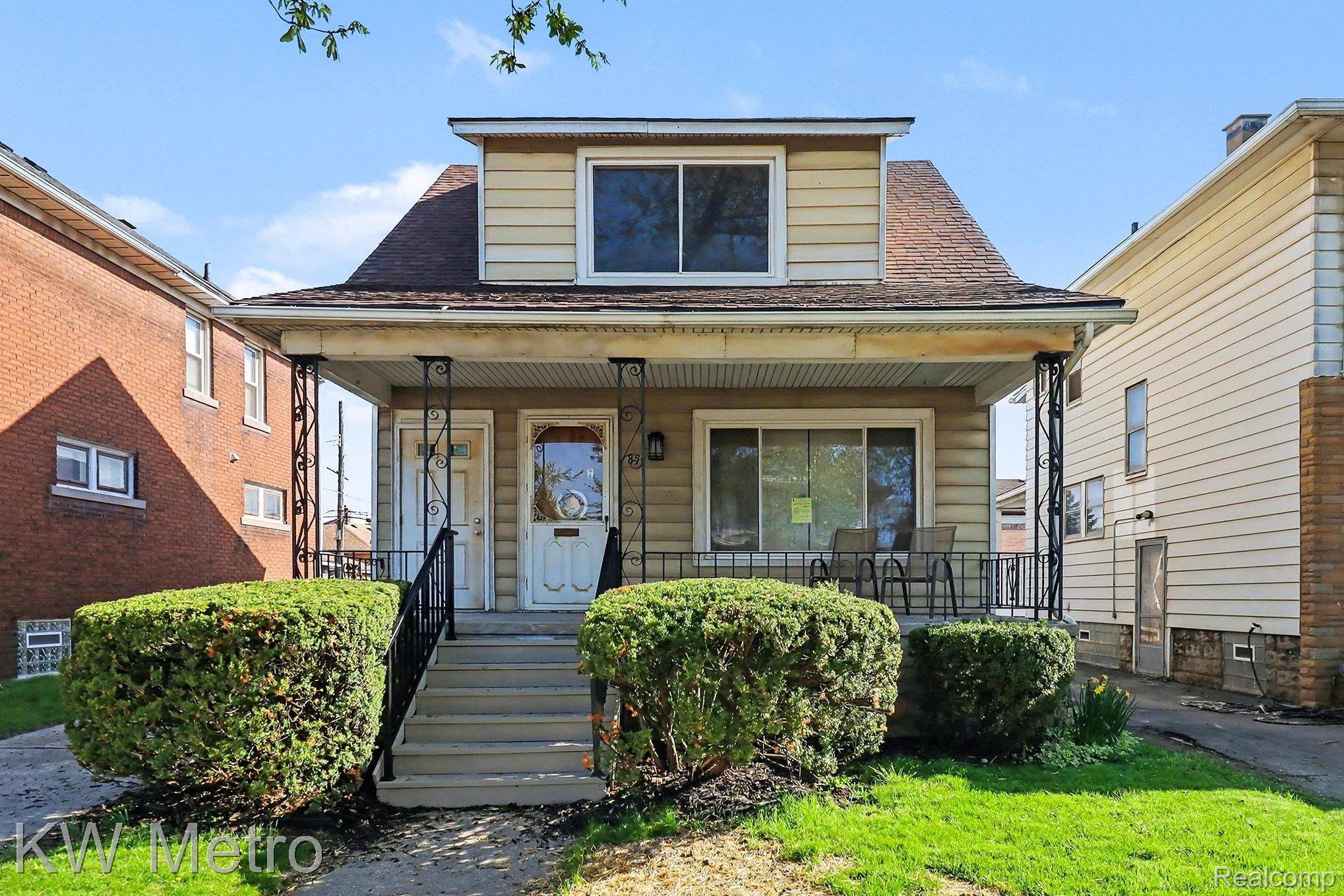 View of front of property with a porch and a shingled roof