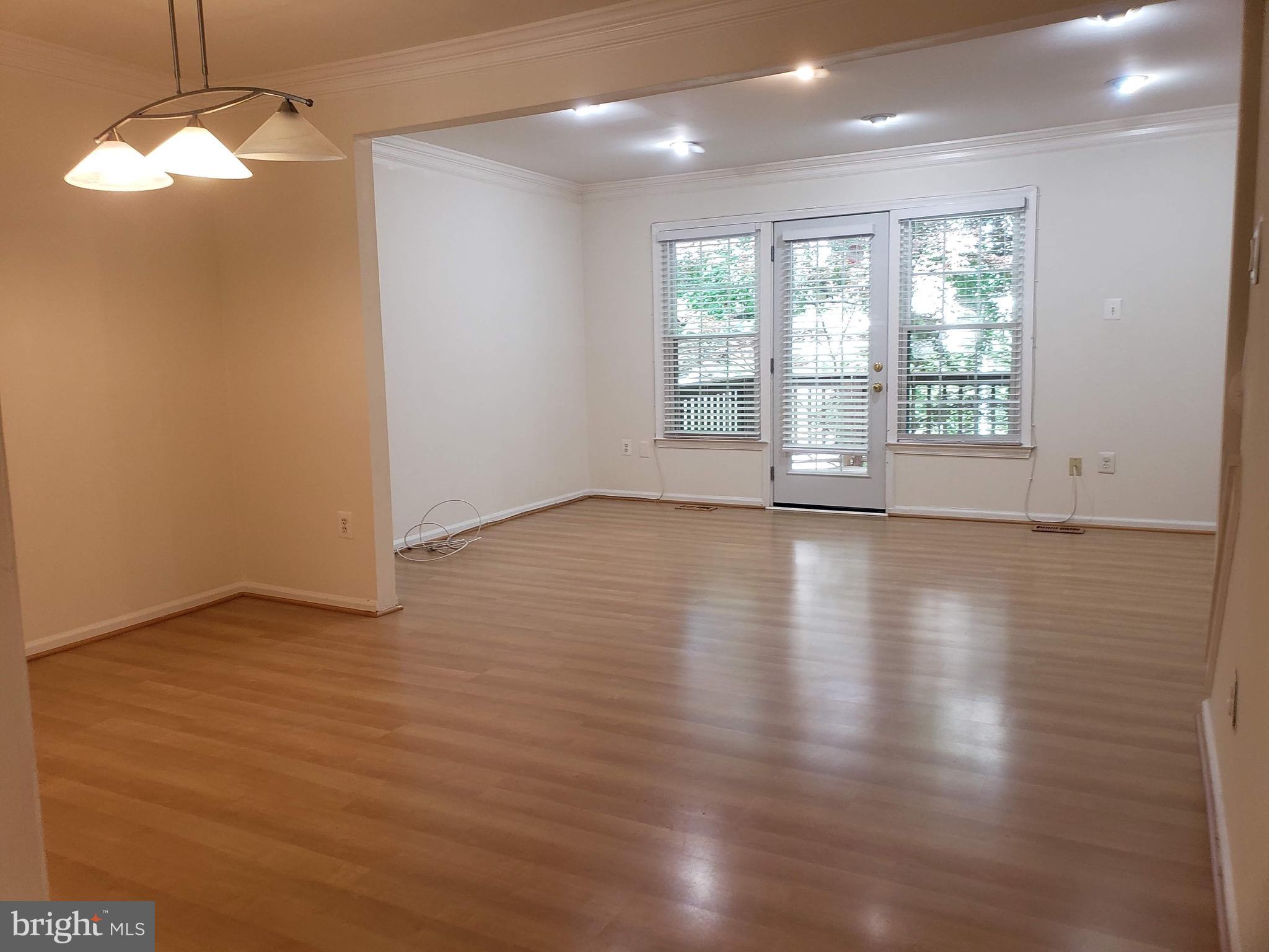 5405 Grove Ridge Way North Bethesda, MD 20852 - Photo 7 of 21 Dining and Living Area with Recessed Lights & Deck