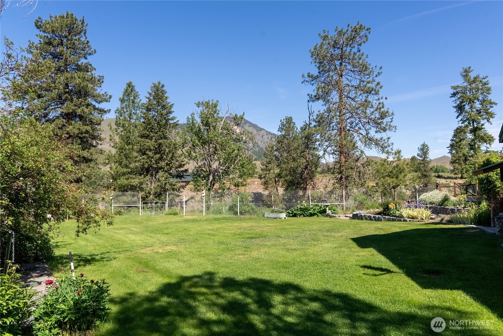 2621 Highway 153 Twisp, WA 98856 - Photo 33 of 40 a backyard of a house with lots of green space and outdoor space