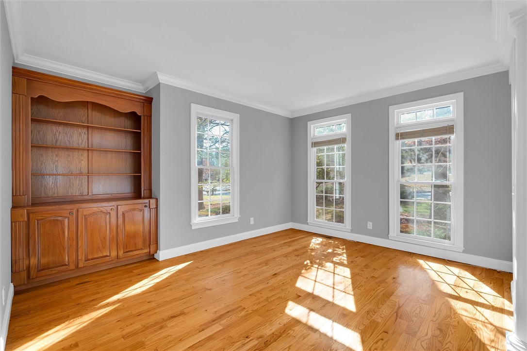204 Red Maple Way Clemson, SC 29631 - Photo 19 of 48 This bright space features rich hardwood floors and elegant built-in shelving, perfect for a versatile living area.