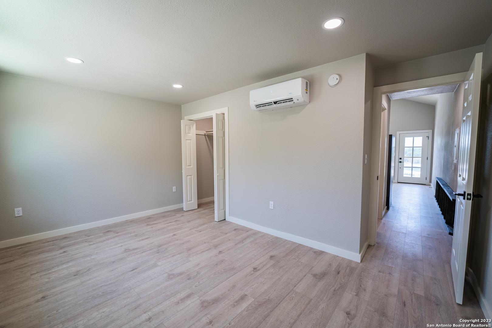 1225 Texas Oaks, Unit D Spring Branch, TX 78070 - Photo 13 of 20 a view of a hallway with wooden floor