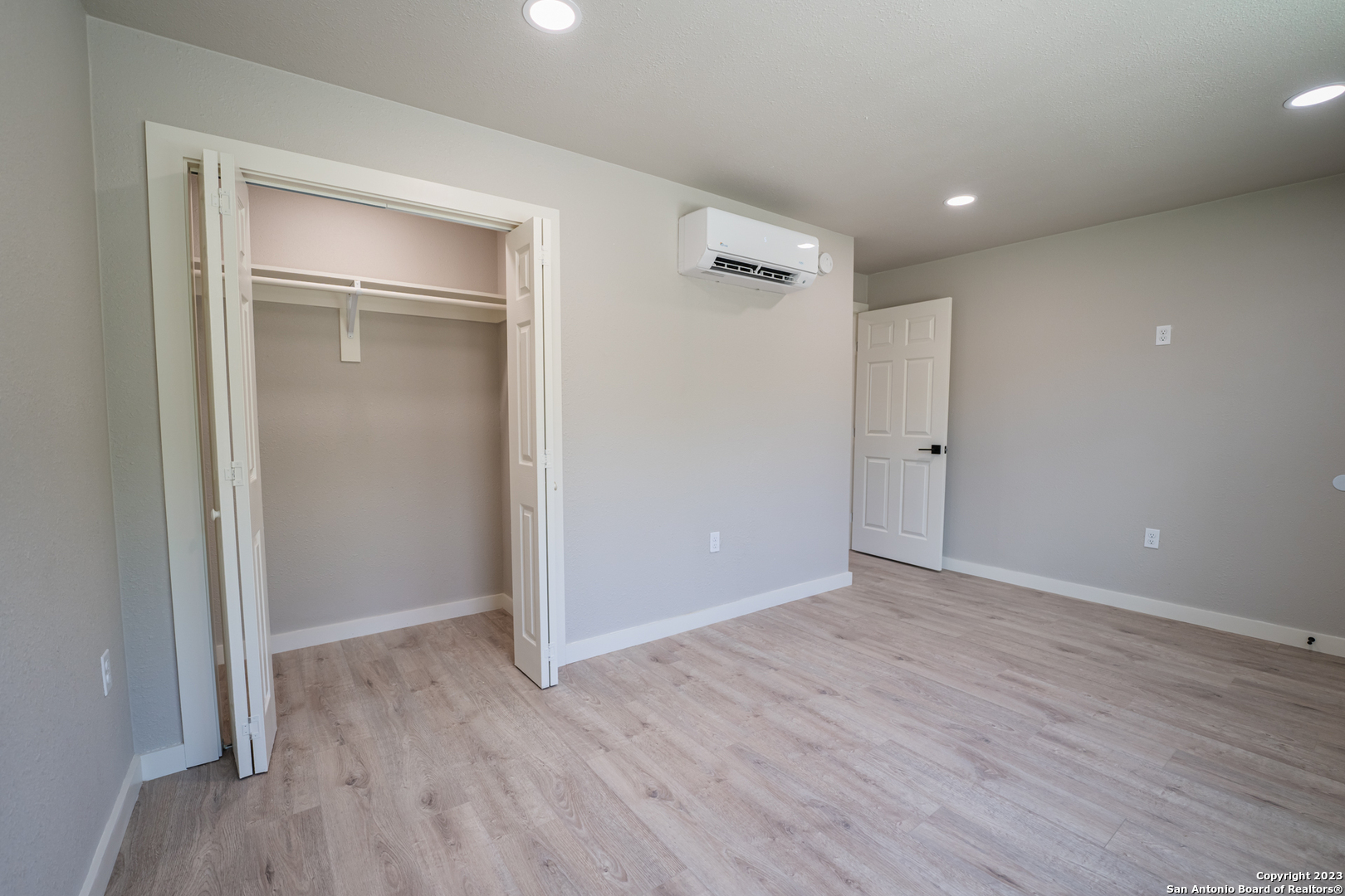 1225 Texas Oaks, Unit D Spring Branch, TX 78070 - Photo 15 of 20 a view of an empty room with wooden floor