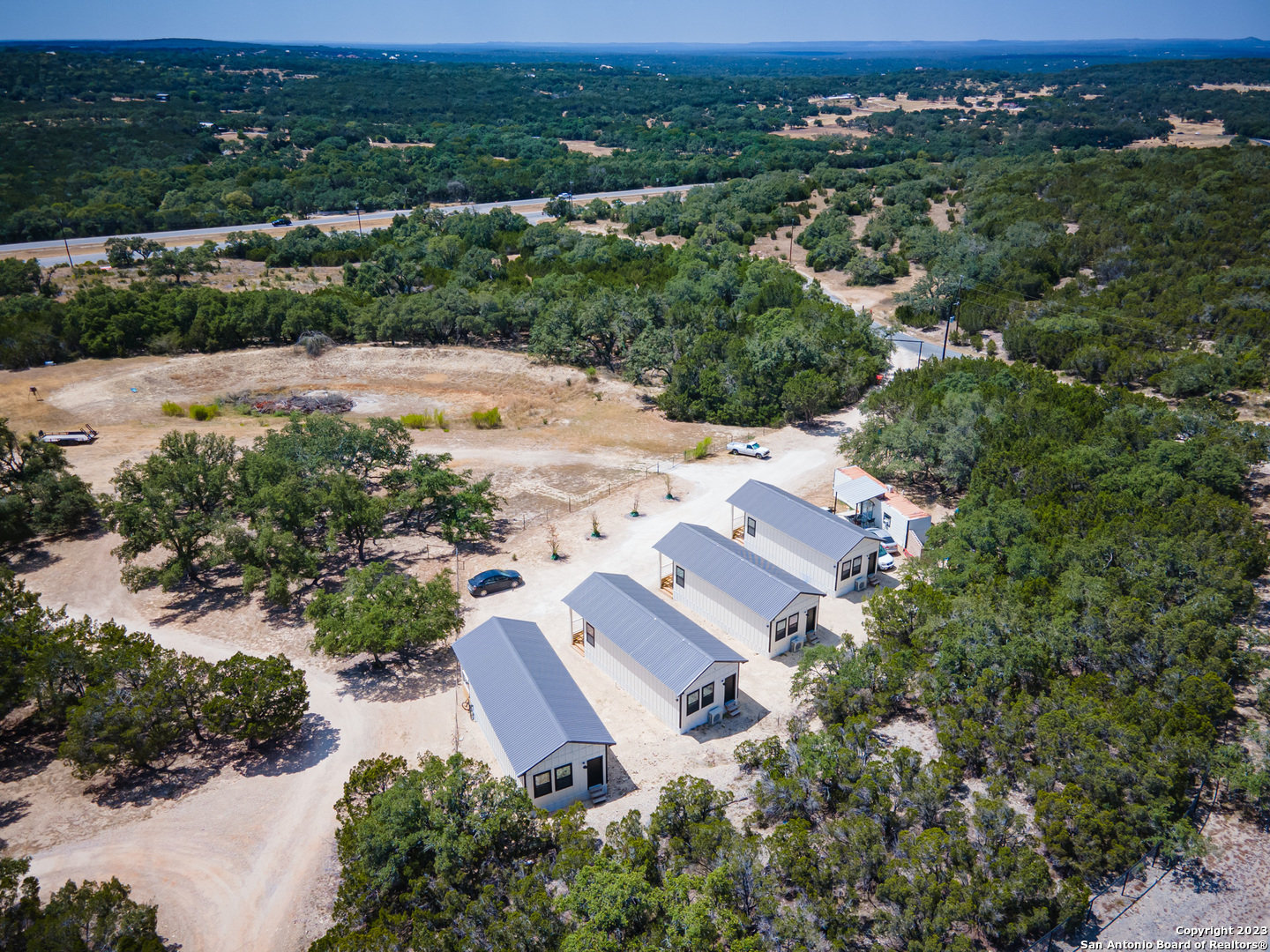 1225 Texas Oaks, Unit D Spring Branch, TX 78070 - Photo 20 of 20 an aerial view of a house with a outdoor space