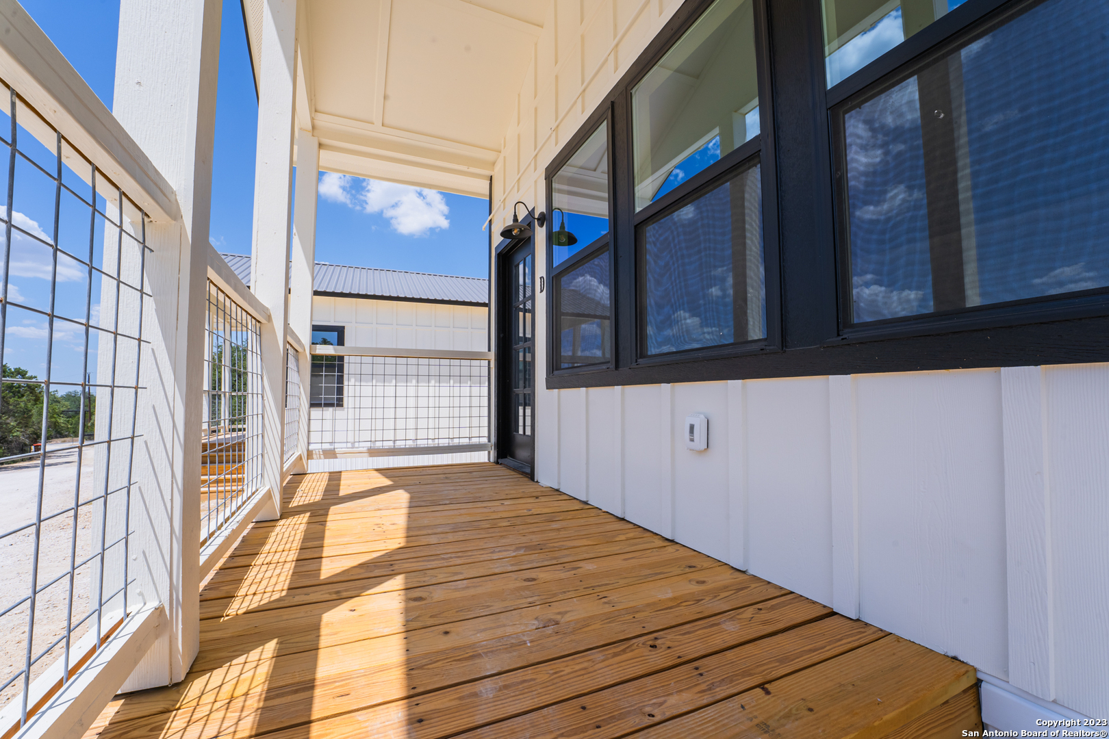 1225 Texas Oaks, Unit D Spring Branch, TX 78070 - Photo 2 of 20 a view of a brick building with a window and entrance