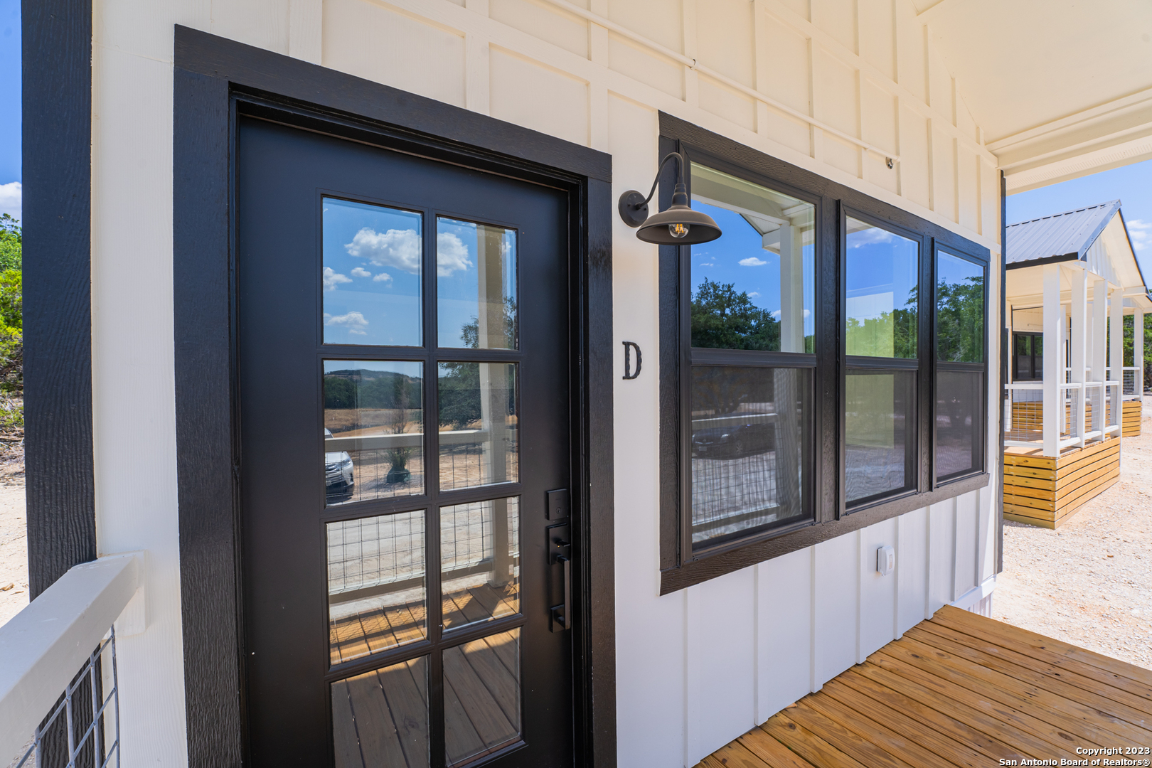 1225 Texas Oaks, Unit D Spring Branch, TX 78070 - Photo 3 of 20 a view of a house with a balcony