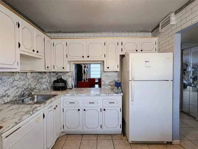 a swimming pool view with a outdoor seating