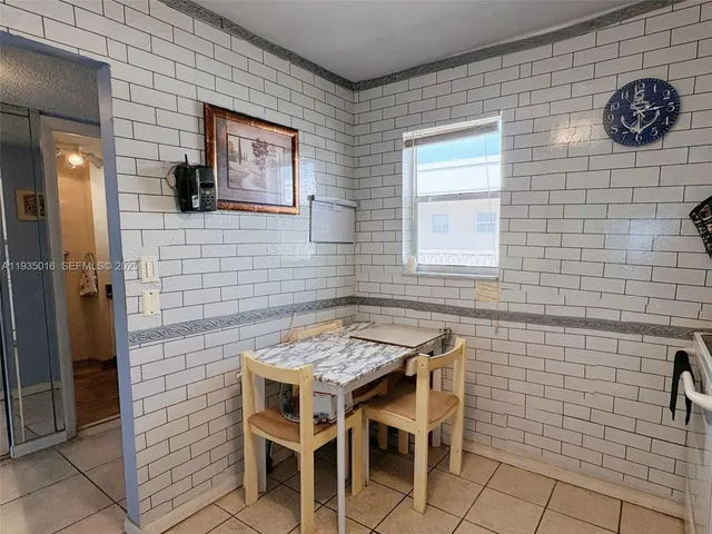 a front view of a building with garden