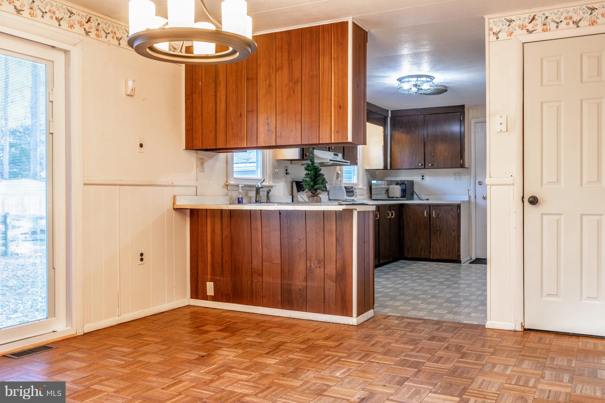 12820 Rousby Hall Road Lusby, MD 20657 - Photo 17 of 39 a view of a kitchen with a sink