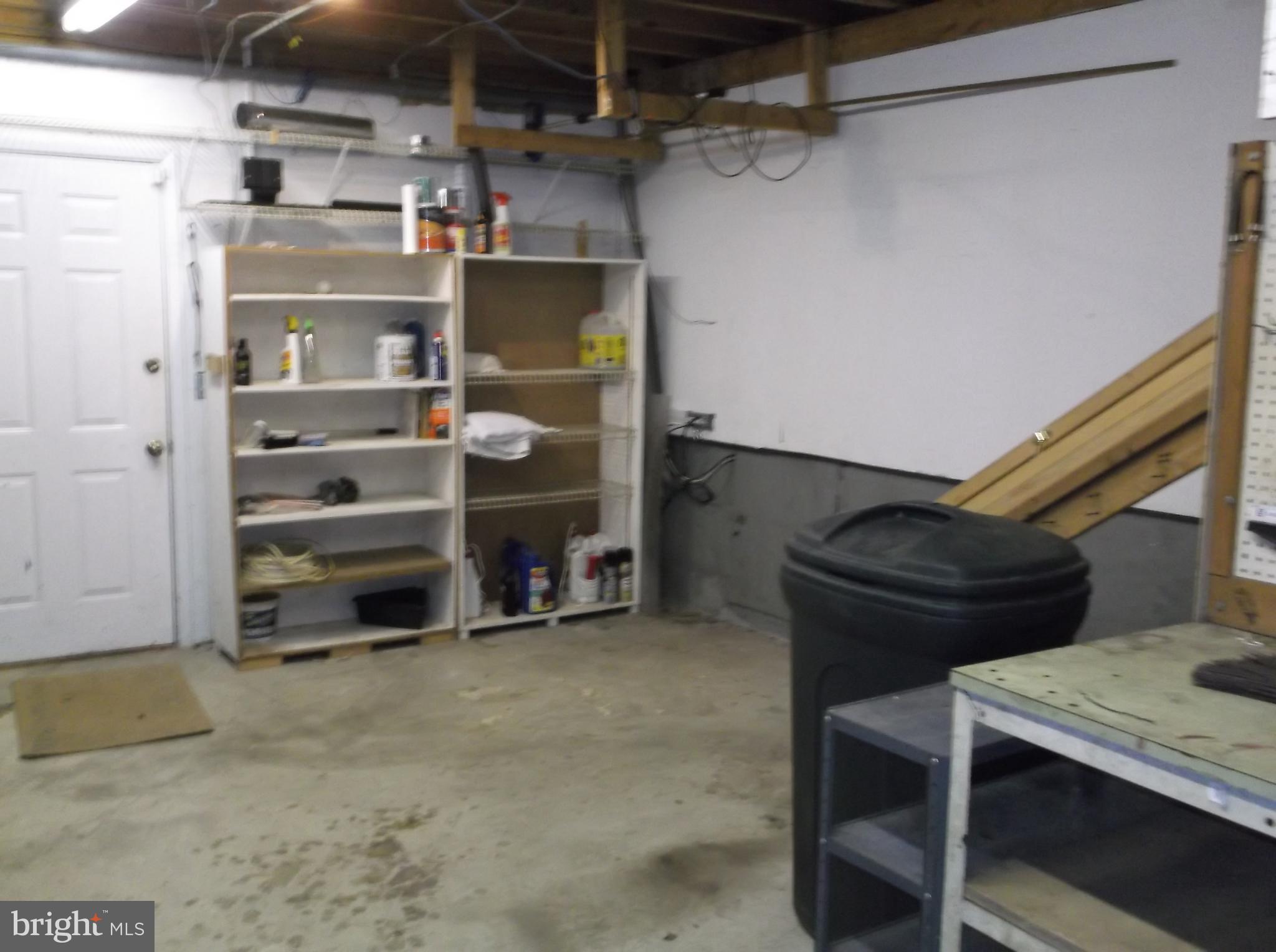 12820 Rousby Hall Road Lusby, MD 20657 - Photo 28 of 39 a view of storage and utility room