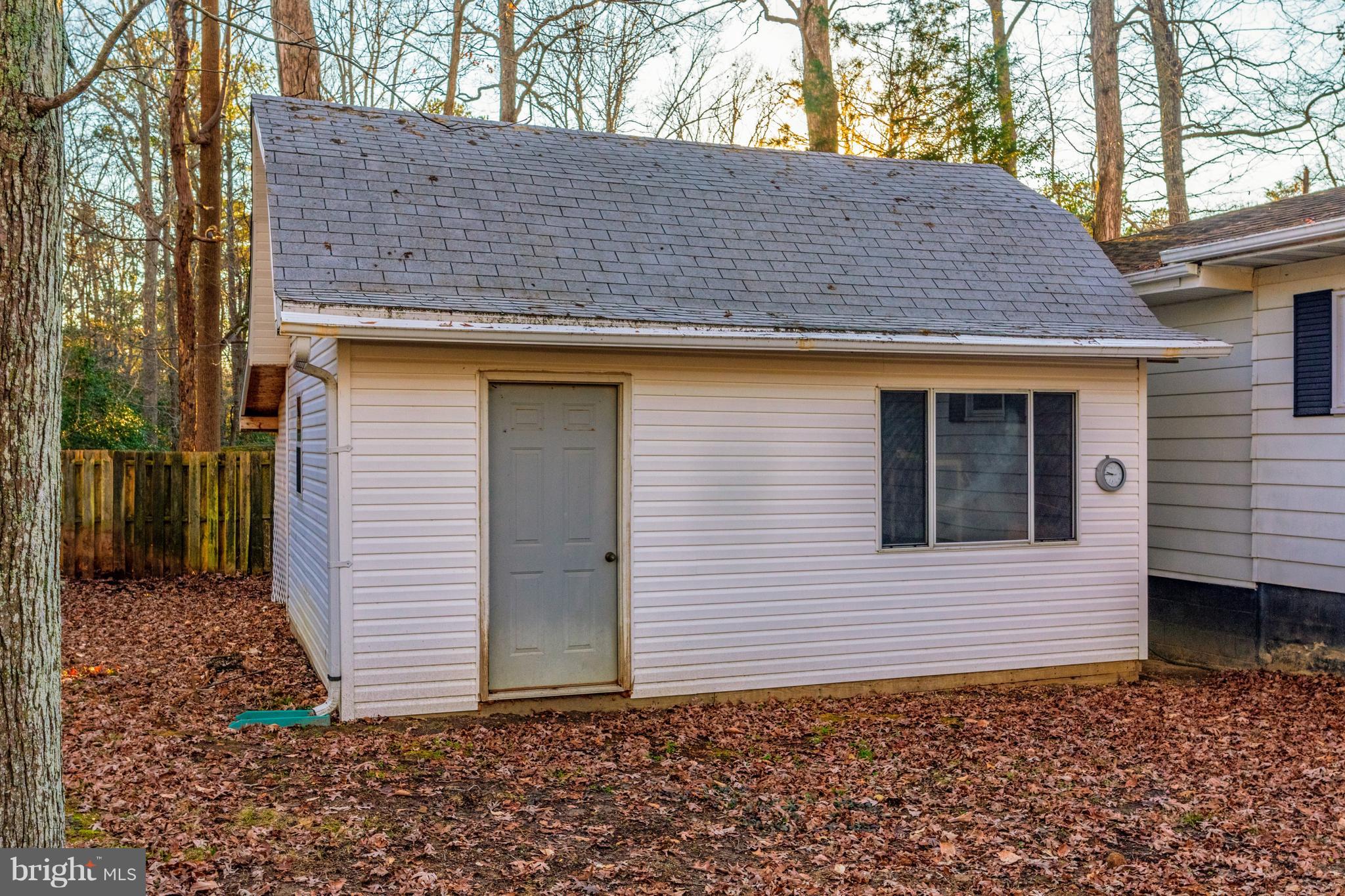 12820 Rousby Hall Road Lusby, MD 20657 - Photo 5 of 39 a backyard of a house