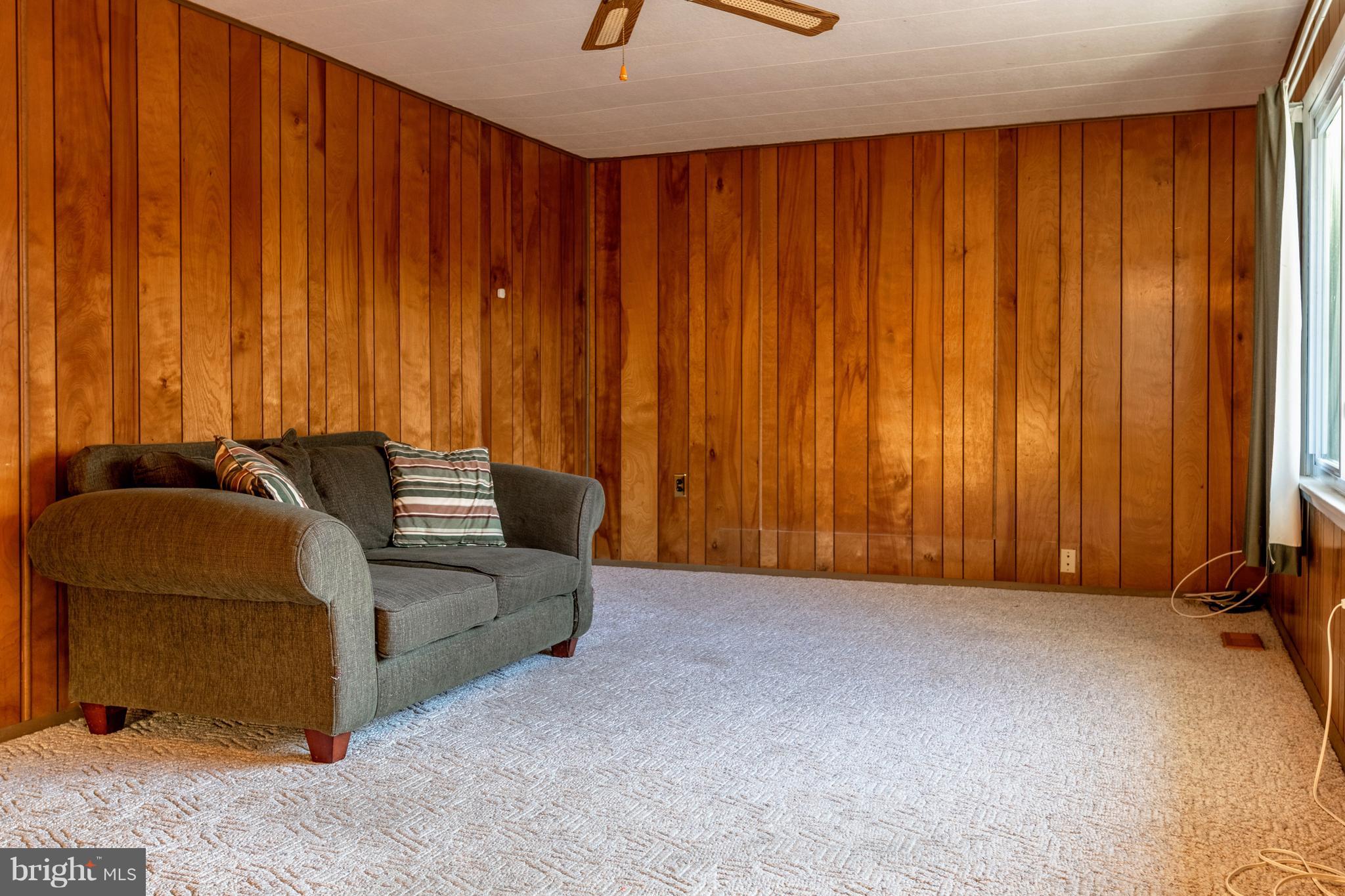 12820 Rousby Hall Road Lusby, MD 20657 - Photo 10 of 39 a view of a livingroom with furniture and a window