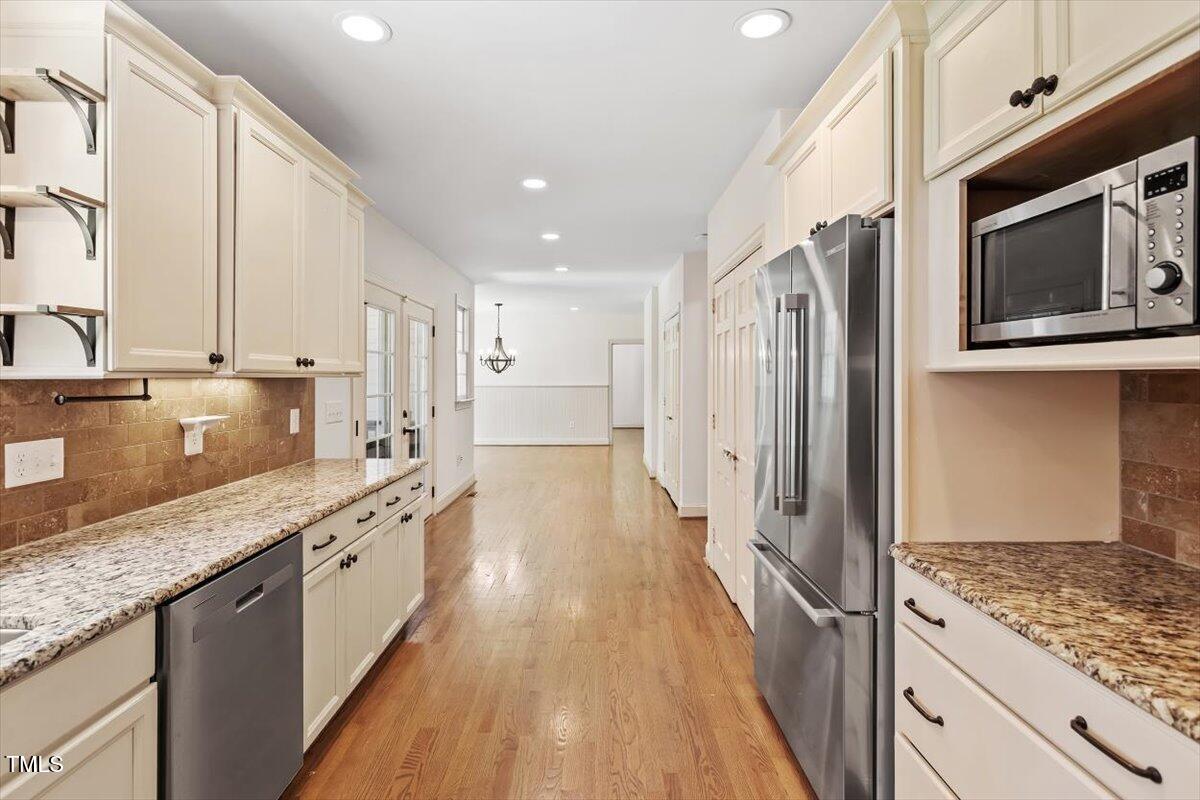 124 Lord Ashley Road Raleigh, NC 27610 - Photo 13 of 32 kitchen, with view of dining room