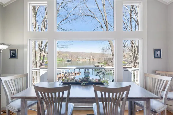 a view of balcony with wooden floor and outdoor seating