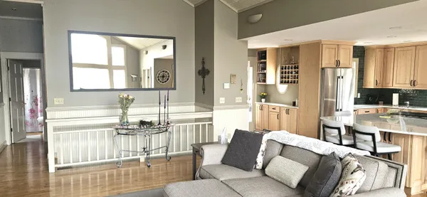 a bathroom with a granite countertop sink a toilet and a mirror
