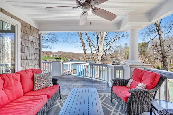 a view of a livingroom with furniture and a floor to ceiling window