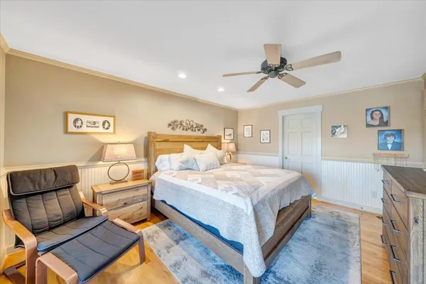 a view of a house with yard and lake view