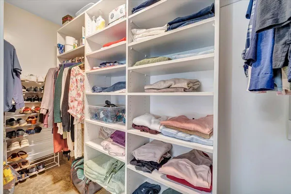 a view of a house with a yard and pathway