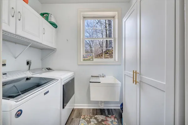 a view of a house with pool and chairs