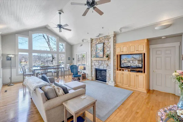 a kitchen with stainless steel appliances granite countertop a sink and a refrigerator